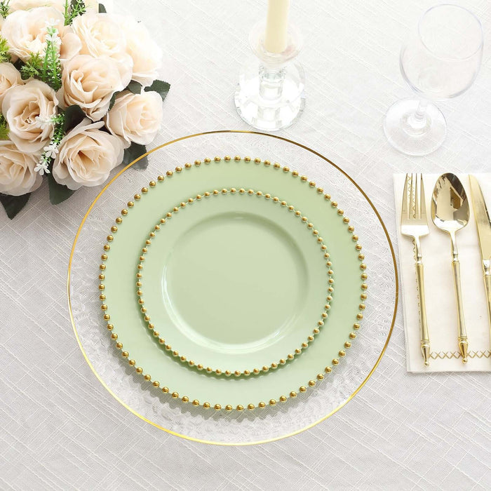 Elegant green plates with gold bead accents on a stylish table setting.