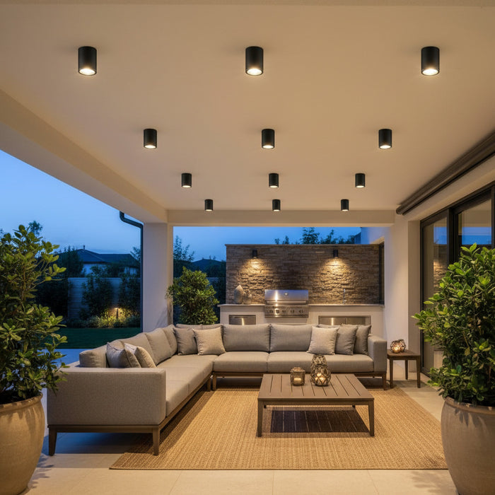 black outdoor surface mounted downlight fitted on the ceiling of an outdoor seating area