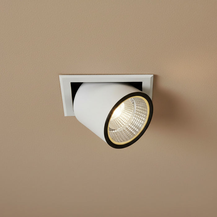white commercial LED recessed spotlight fitting in a shop ceiling