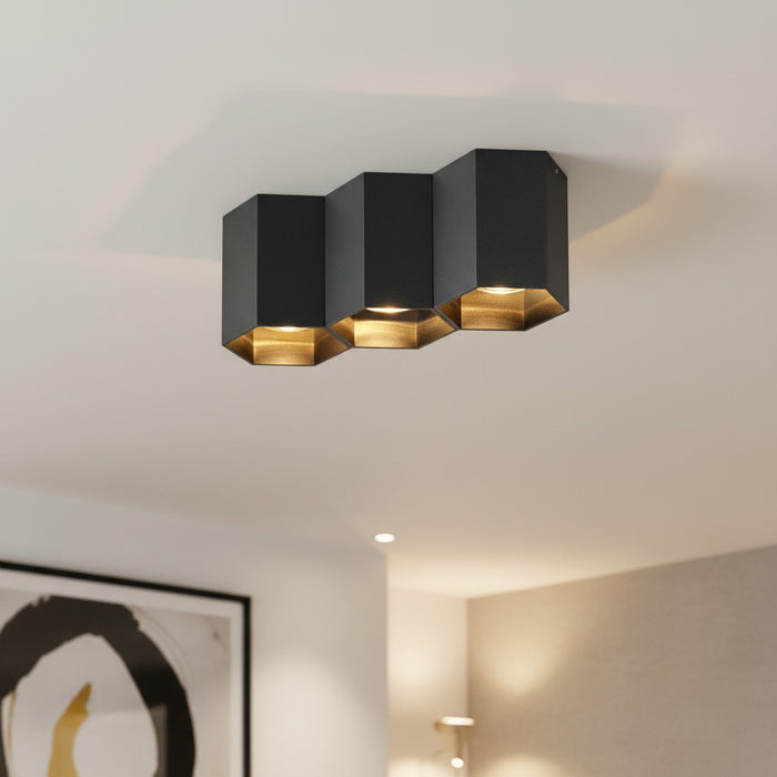 black flush ceiling lamp mounted on the ceiling in a hotel lounge