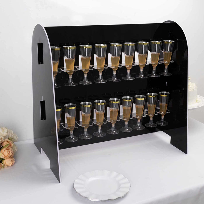 Black champagne glass display rack with glasses filled on three tiers.