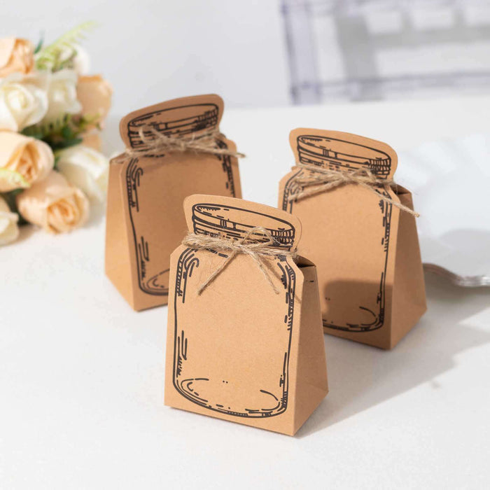 Brown paper gift boxes with jar design and twine, arranged on a table.