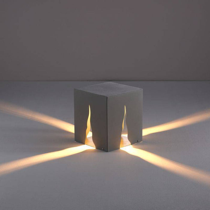 Black contemporary bollard light on a grey background