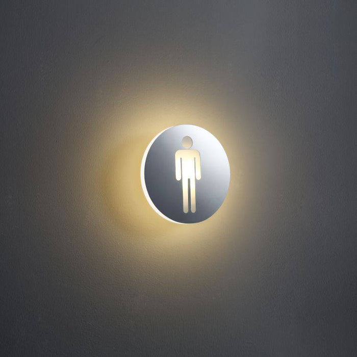 LED male WC sign shown on a white wall