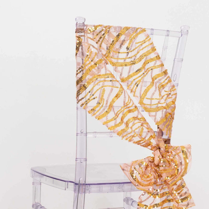 Gold sequined ribbon draped on a clear chair against a white background.