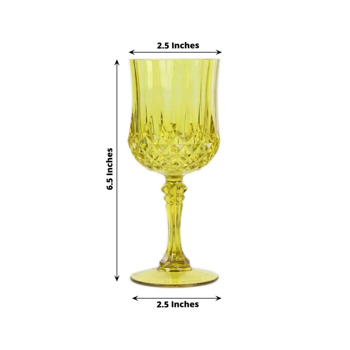 Yellow crystal goblet with detailed design, 6.5 inches tall and 2.5 inches wide.