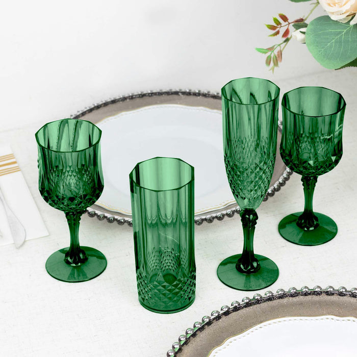 Set of four elegant green glassware pieces on a table setting.