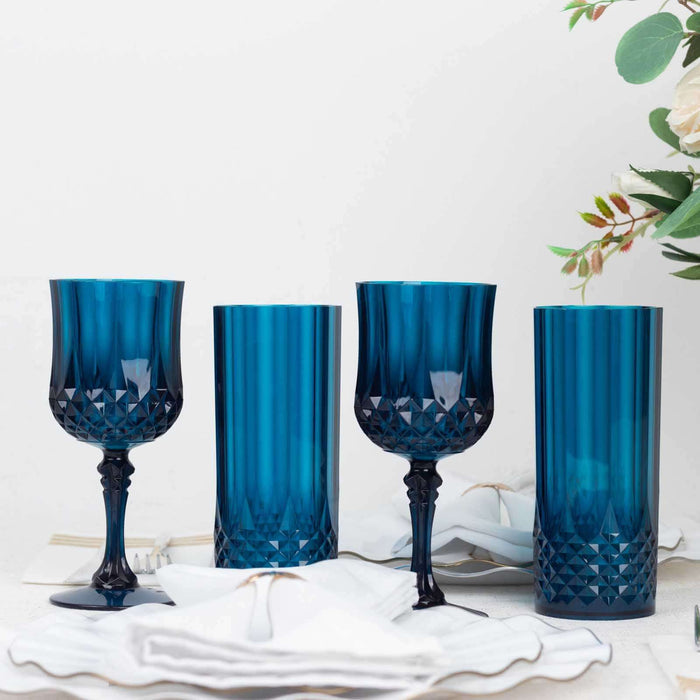 Set of four blue decorative glasses in varying shapes and sizes.