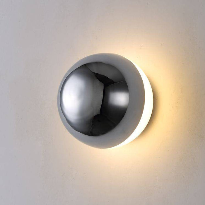Chrome indoor wall light on a white background