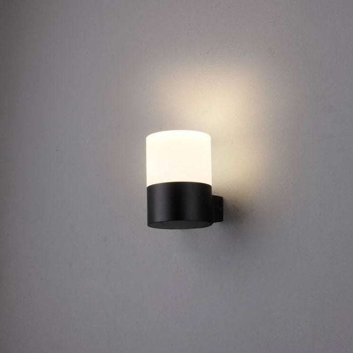 black outside wall mount light shown on a white wall