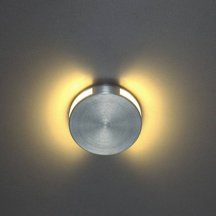 silver interior step light mounted on a white wall
