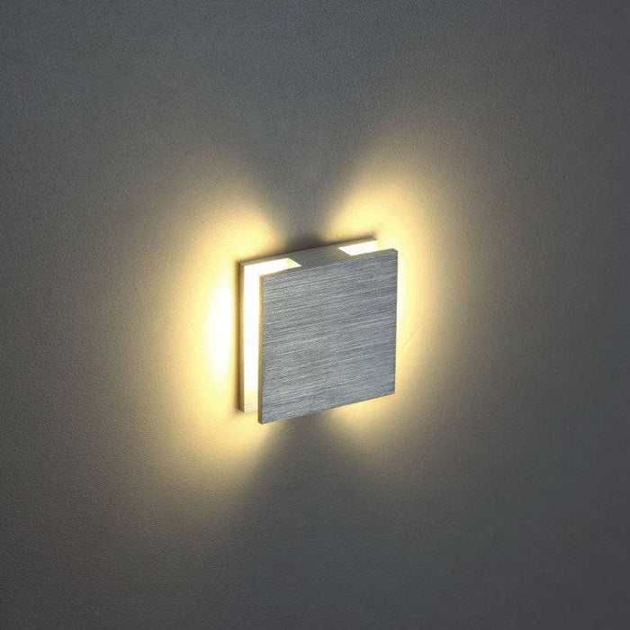 silver interior stair light mounted on a white wall
