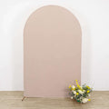 Arch backdrop with floral arrangement in front