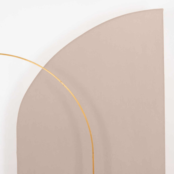 Curved beige backdrop with a gold arch detail.