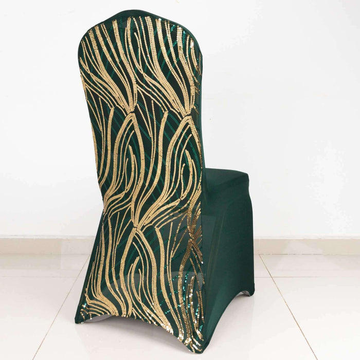 Green chair cover with gold leaf design on a plain backdrop.