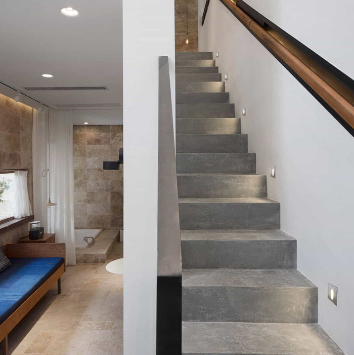 silver lights for staircase wall mounted alongside a modern staircase