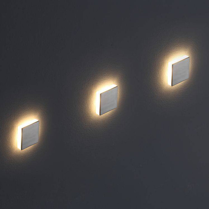 mini interior step light installed on a grey wall
