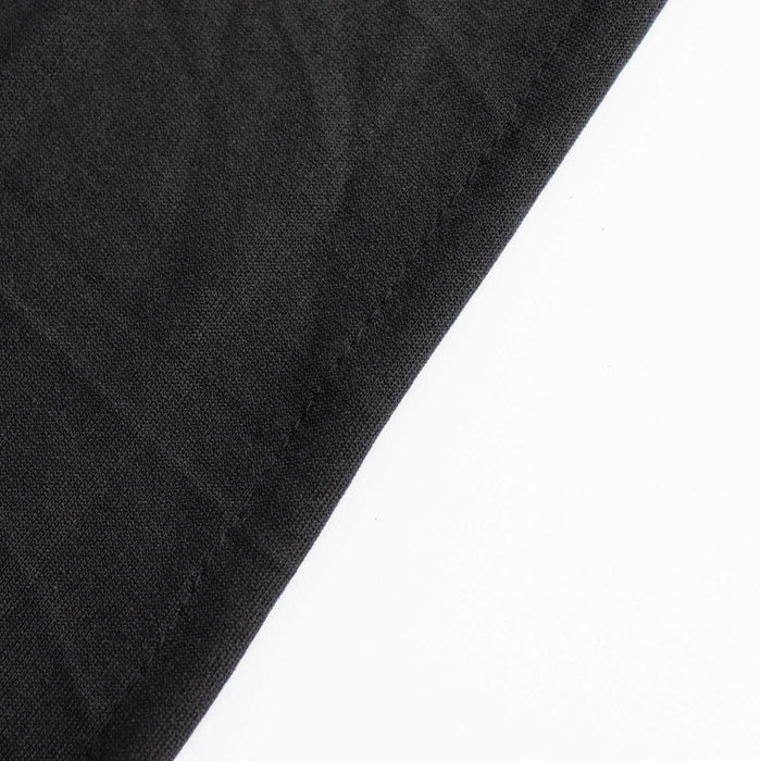 Black fabric corner showing stitching detail.