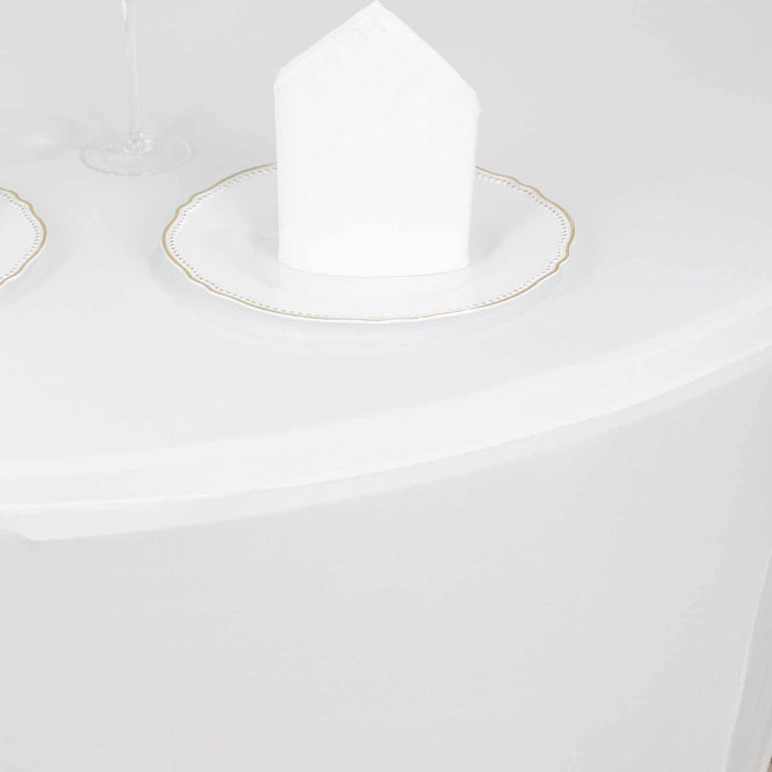 Elegant white napkin on a decorative plate at a dining table.
