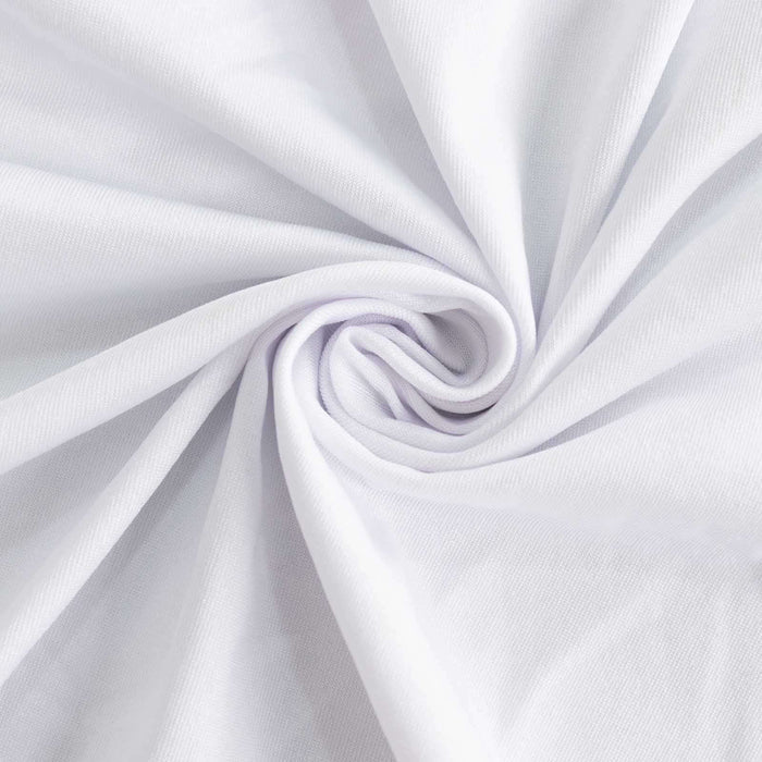 White fabric with a smooth, soft texture, folded in a spiral pattern. #whtbkgd