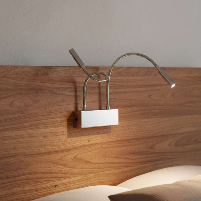 chrome overbed reading light mounted on a wooden headboard